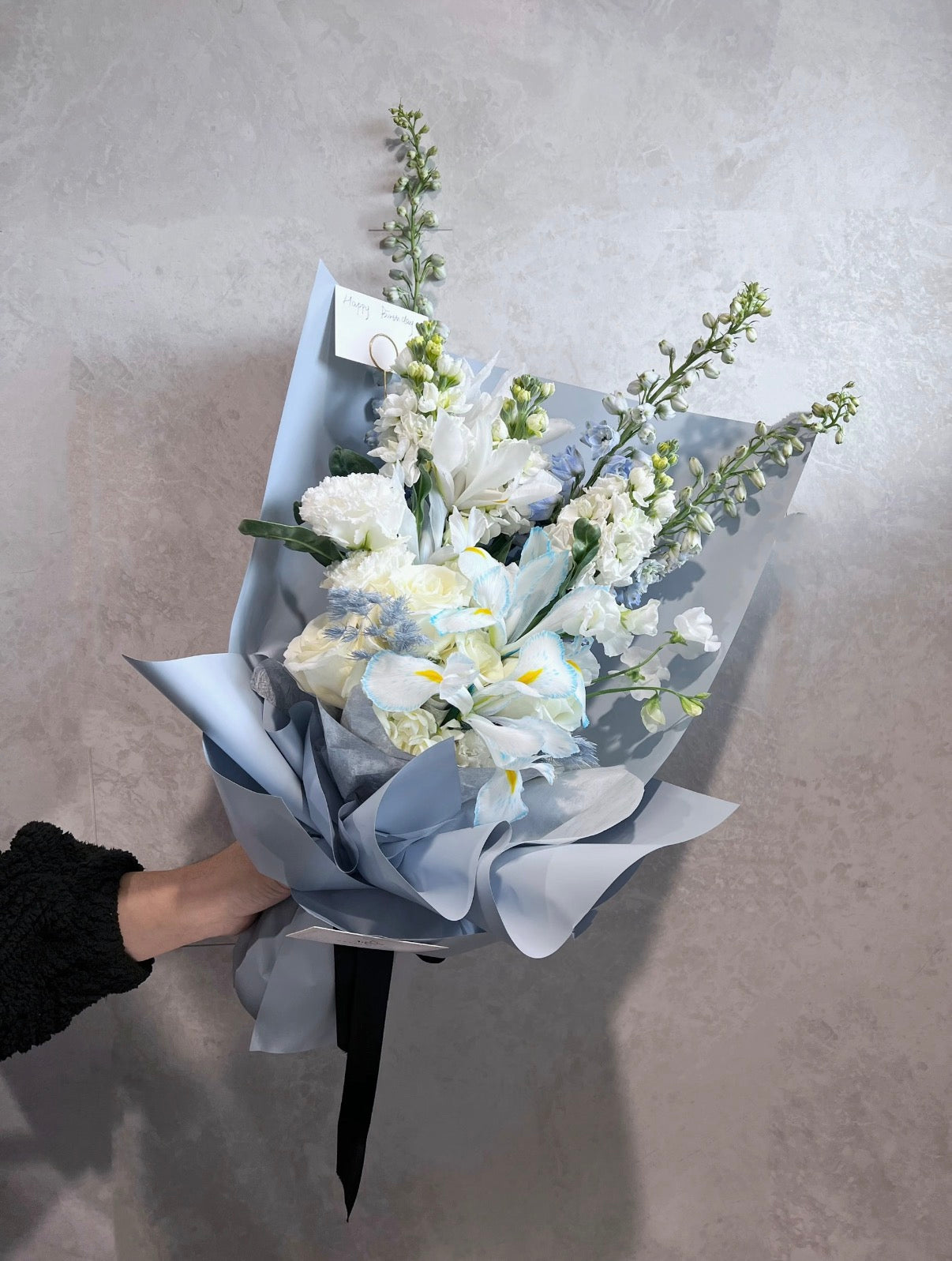 Blue delphinium bouquet with white roses
