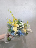 Blue hydrangea bouquet with yellow orchids