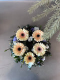 Circular funeral flower wreath for memorial service