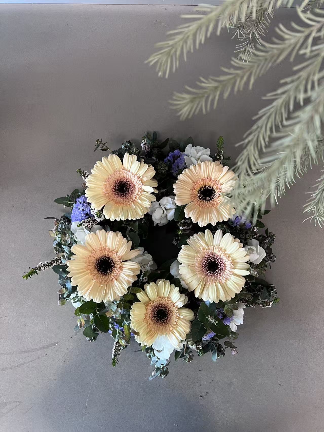 Circular funeral flower wreath for memorial service
