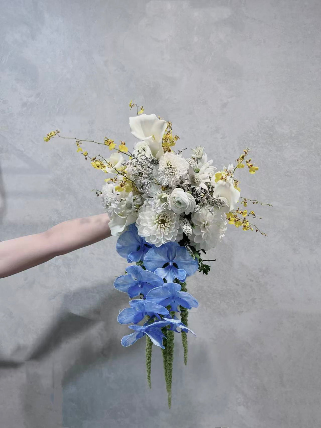 Ivory and blue cascading flower bouquet