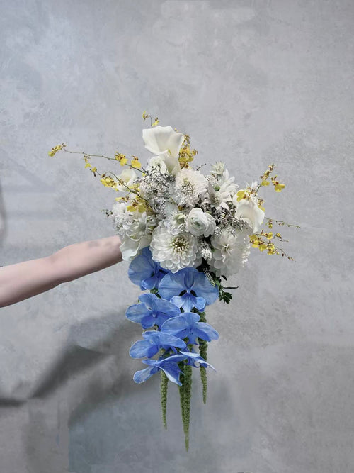 Ivory and blue cascading flower bouquet