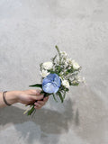 Ivory and blue flower bouquet with greenery