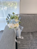 Pale blue and white flower bouquet