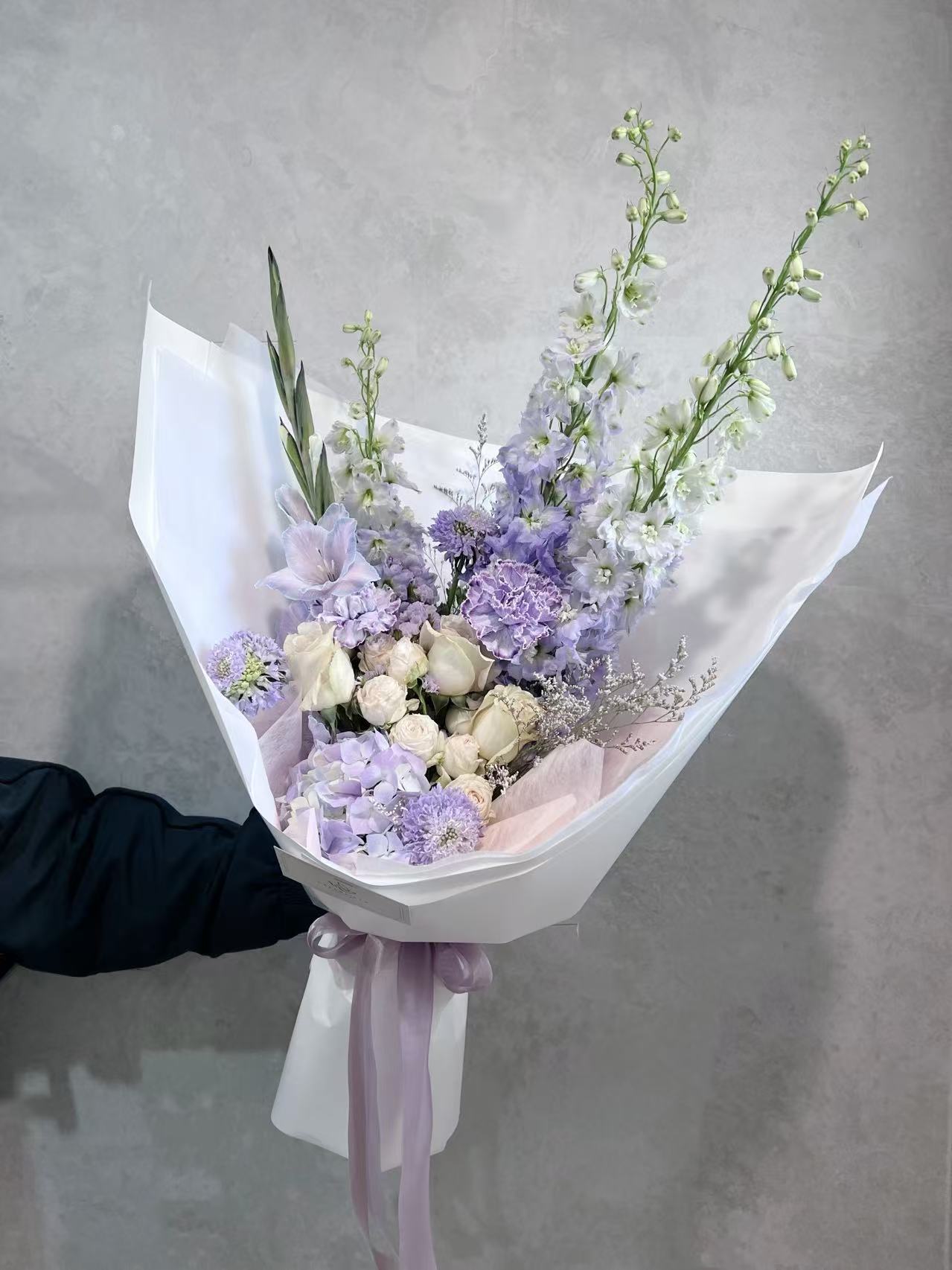 Soft pink, purple and white pastel flower bouquet with delicate seasonal blooms