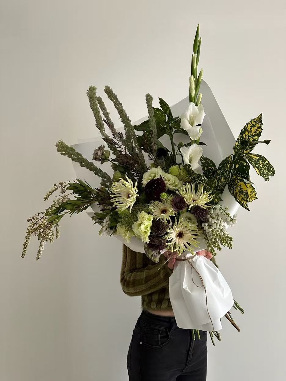 Green and burgundy organic style flower bouquet