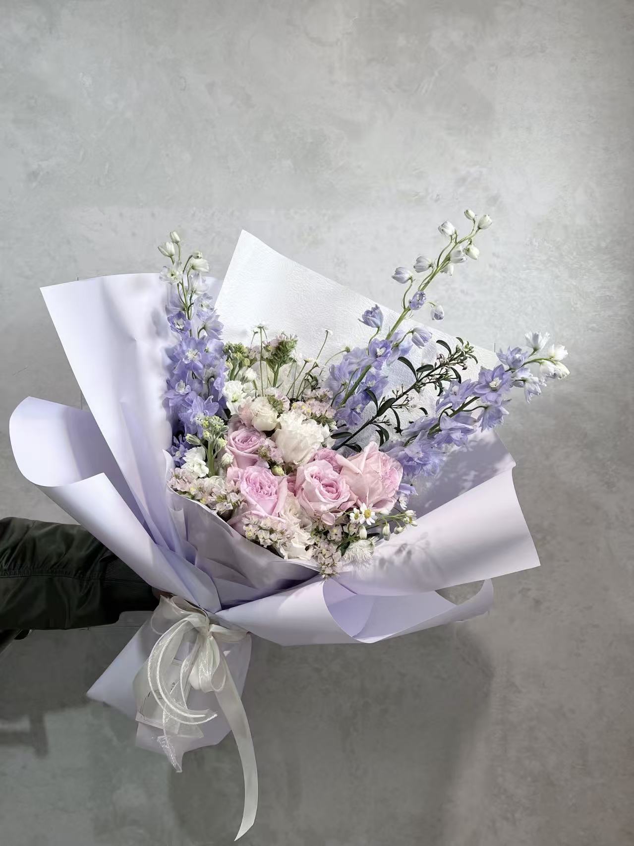 Soft pink, purple and white pastel flower bouquet with delicate seasonal blooms
